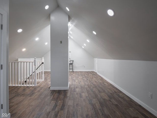 bonus room with dark hardwood / wood-style flooring and lofted ceiling