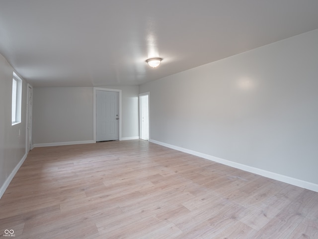 spare room with light hardwood / wood-style floors