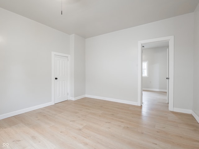 unfurnished room featuring light wood-type flooring