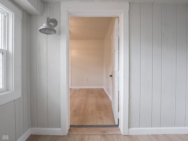 hall with light hardwood / wood-style floors