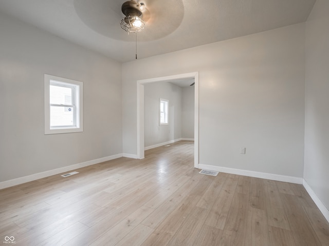 unfurnished room with ceiling fan and light hardwood / wood-style flooring