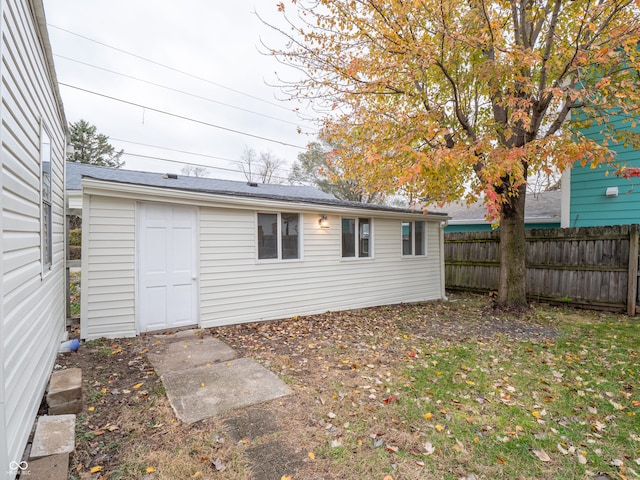 rear view of property with an outbuilding