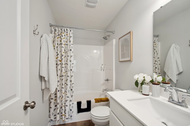 full bathroom with wood-type flooring, vanity, toilet, and shower / bath combo with shower curtain