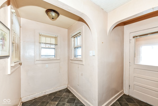 doorway to outside with a wealth of natural light