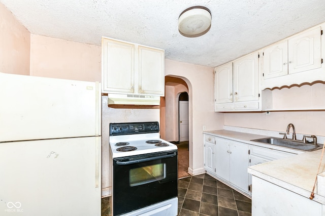 kitchen featuring a textured ceiling, white cabinetry, white appliances, and sink