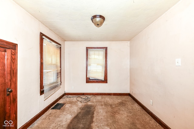 unfurnished room with carpet