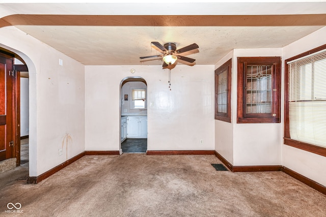 carpeted empty room with ceiling fan