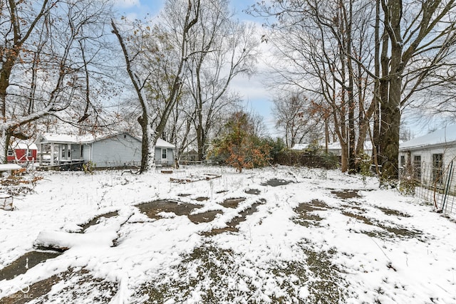 view of yard covered in snow