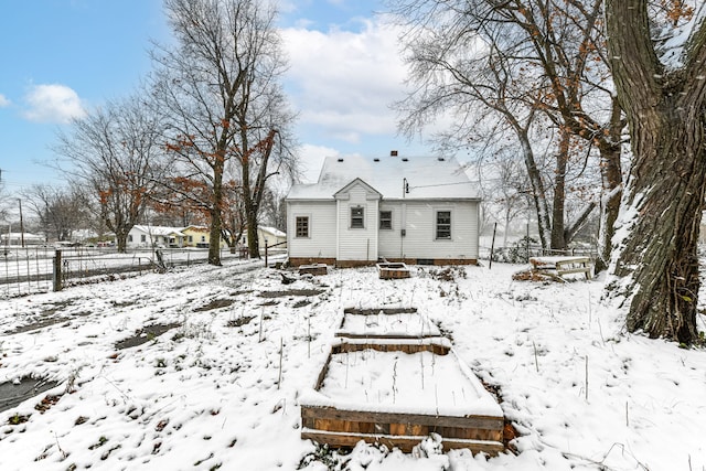 view of snow covered house