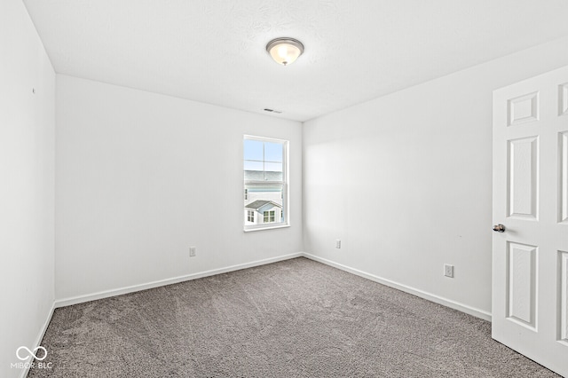 spare room with carpet flooring