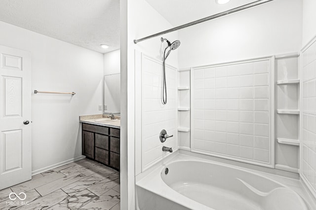 bathroom featuring vanity, a textured ceiling, and washtub / shower combination