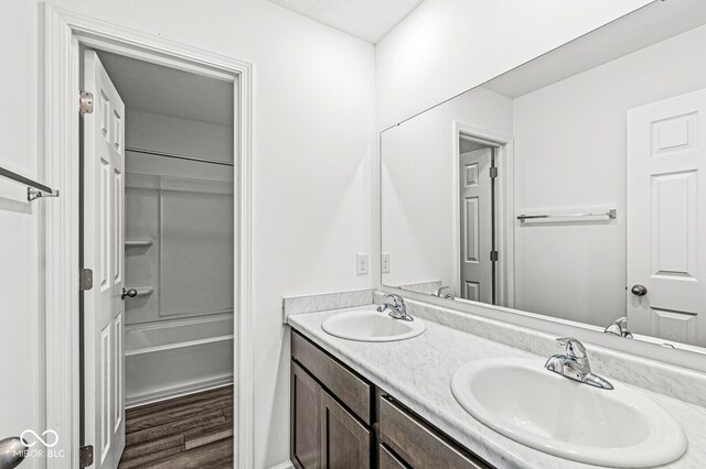 bathroom with vanity and wood-type flooring