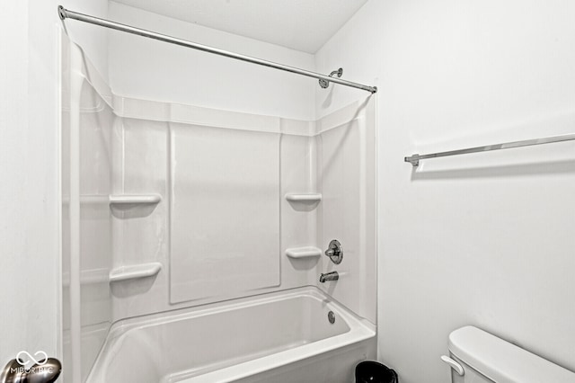 bathroom featuring toilet and bathtub / shower combination