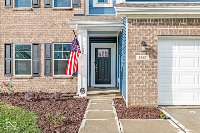 doorway to property featuring a garage