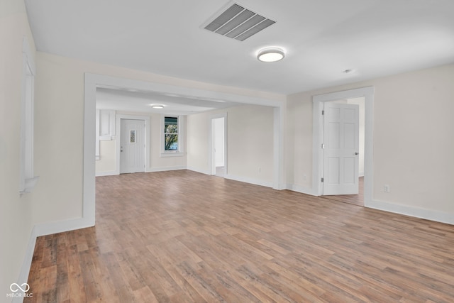 spare room with light wood-type flooring