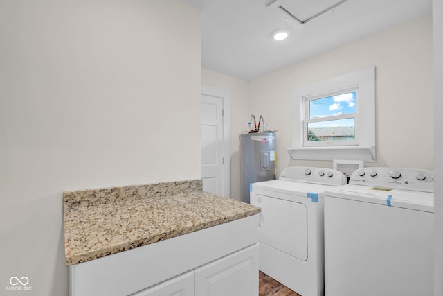 laundry room with electric water heater, wood-type flooring, and independent washer and dryer