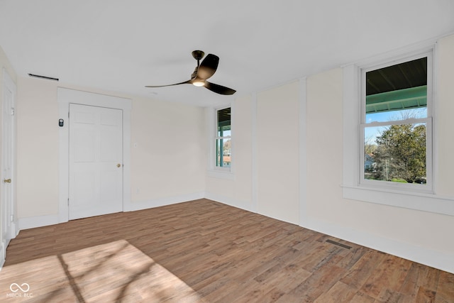 spare room with ceiling fan and light hardwood / wood-style flooring