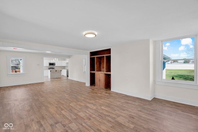 unfurnished living room with light hardwood / wood-style floors