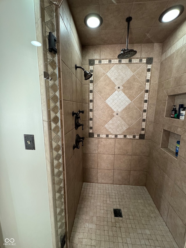 bathroom with a tile shower