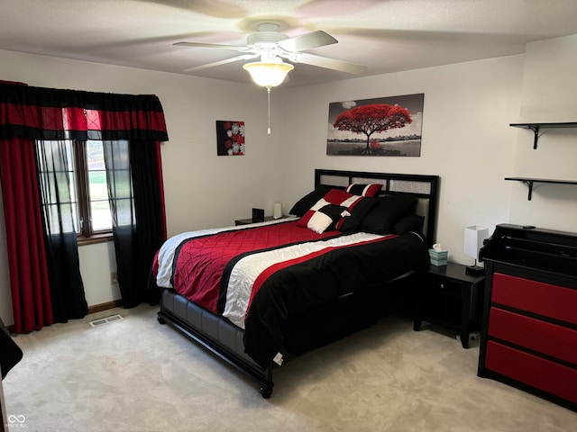 bedroom with light colored carpet and ceiling fan