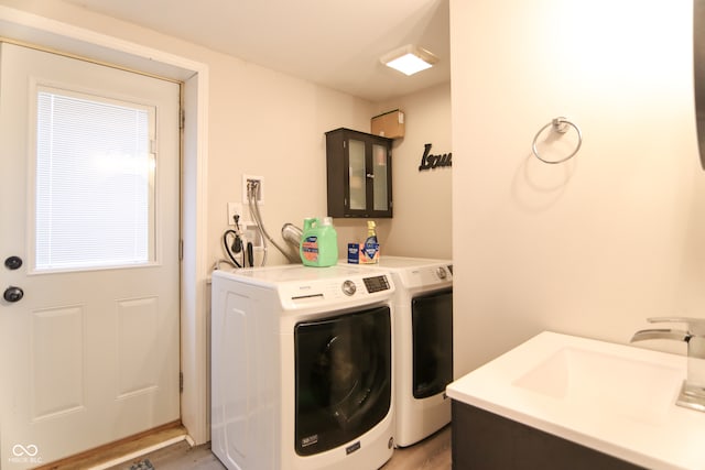 laundry room featuring independent washer and dryer and dark wood-type flooring