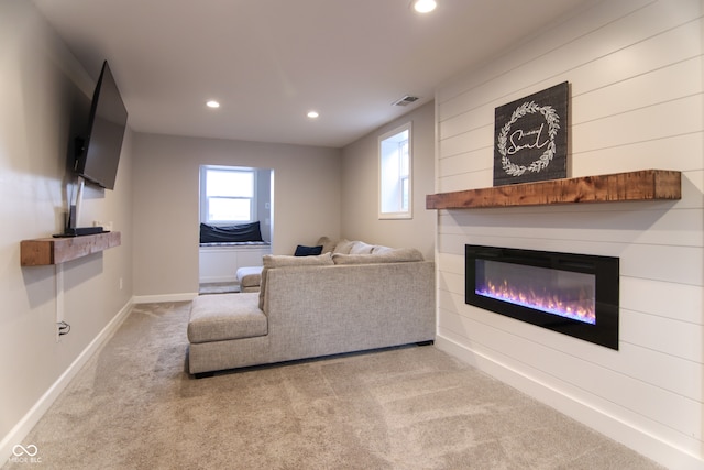 unfurnished living room with light colored carpet