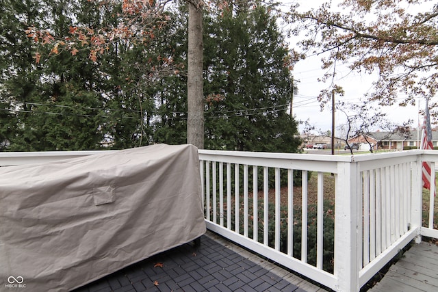 wooden terrace featuring area for grilling