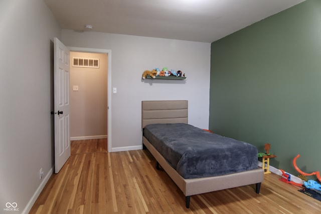 bedroom featuring light hardwood / wood-style floors