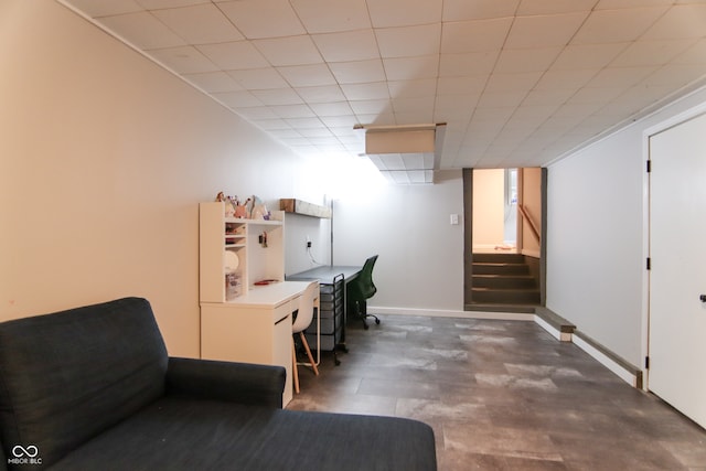 office space with a paneled ceiling