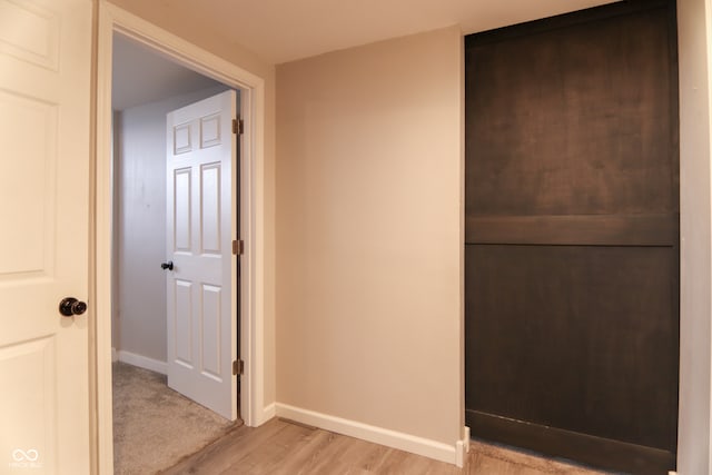 corridor featuring light hardwood / wood-style floors