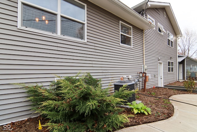 view of side of property featuring cooling unit