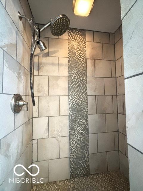 room details with a tile shower