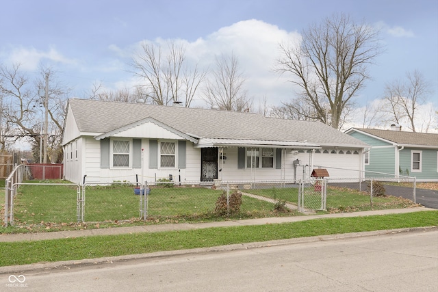 single story home with a front yard and a garage