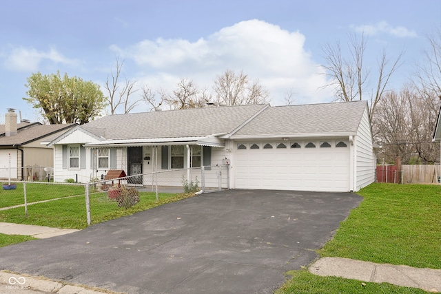 single story home featuring a front yard and a garage