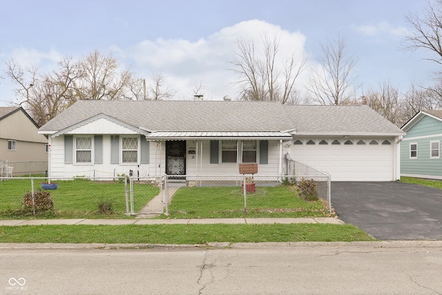 ranch-style home featuring a porch, a front yard, and a garage