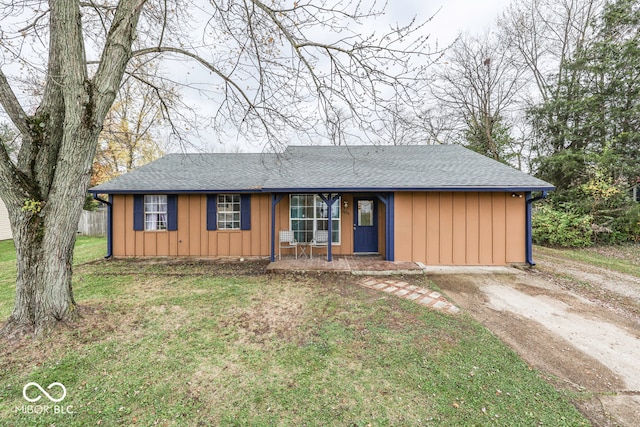 ranch-style house with a front lawn