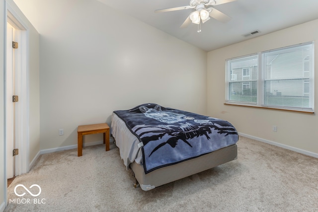 carpeted bedroom with ceiling fan