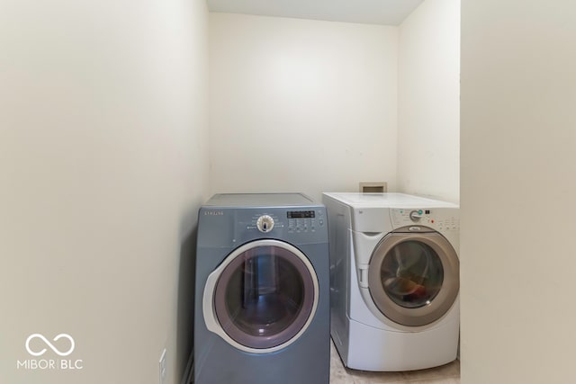 laundry room with washing machine and dryer