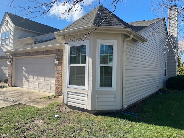 view of property exterior with a yard