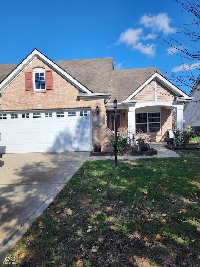 4835 Franklin Villas Dr, Indianapolis, IN 46237 - view of front of property featuring brick siding, driveway, a front lawn, and a garage