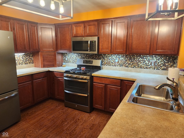 kitchen with tasteful backsplash, sink, dark hardwood / wood-style floors, and appliances with stainless steel finishes