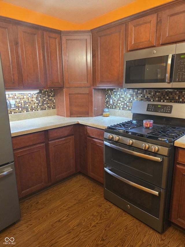 4835 Franklin Villas Dr, Indianapolis, IN 46237 - kitchen with appliances with stainless steel finishes, tasteful backsplash, and light countertops