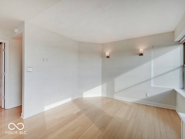 unfurnished room with light hardwood / wood-style floors