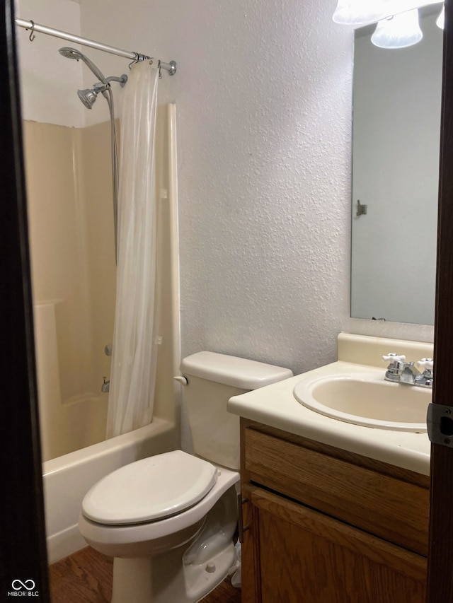 full bathroom featuring vanity, toilet, and shower / tub combo