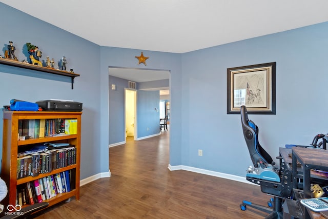 office space with dark hardwood / wood-style floors