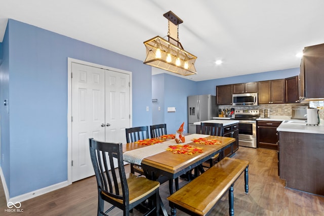 dining area featuring dark hardwood / wood-style flooring