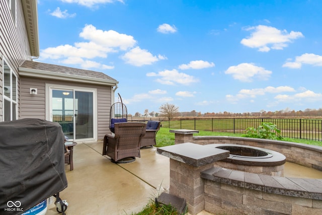 view of patio / terrace featuring a fire pit and grilling area