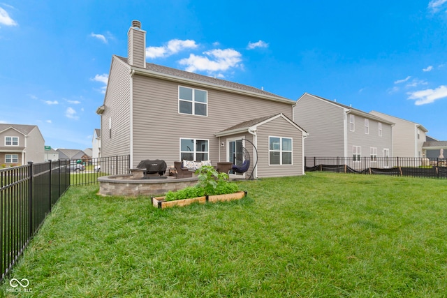 back of property featuring a lawn and a patio area