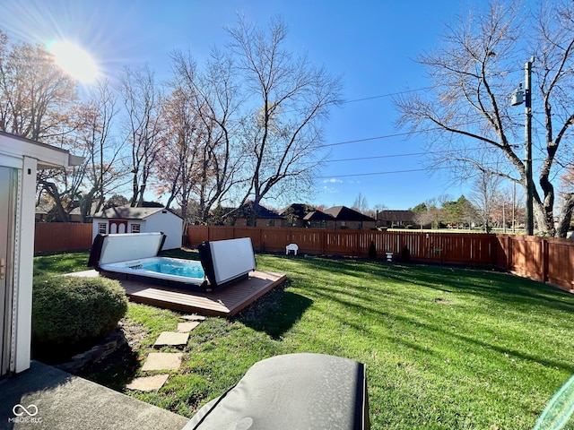 view of yard featuring a shed and a wooden deck