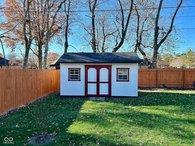 view of outbuilding featuring a lawn
